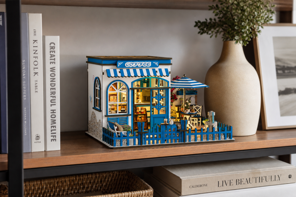 Seaside Coffee House Miniature House Kit shown in an AI-generated lifestyle scene
